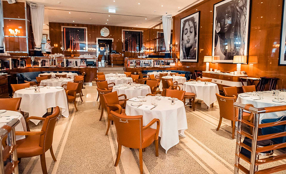 Chef presenting a dish at Cipriani Italian Restaurants Dubai